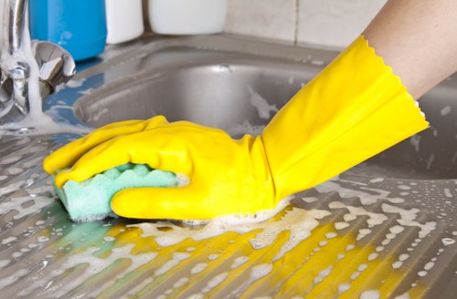 Professional carpet cleaners treating a stained carpet in a local property