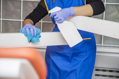 Staff member following safe carpet cleaning procedures